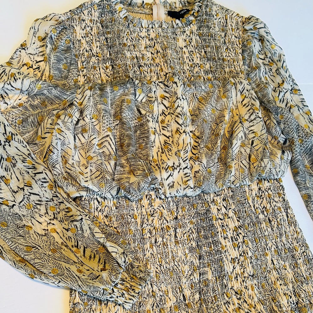 This cute size large dress with long sleeve and ruffled skirt.